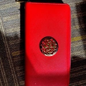 Red wallet with a detachable wristlet